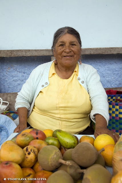 Rozalia, 87 years old, sells vegetables and fruits in front of her house produced in her garden